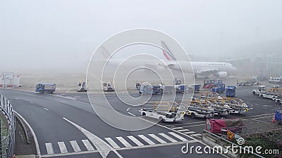 PARIS, FRANCE - JANUARY, 1, 2017. Airbus planes on aircraft parking at Charles de Gaulle airport. Foggy day Editorial Stock Photo