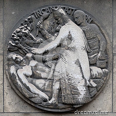 Incantation. Stone relief at the building of the Faculte de Medicine Paris. Stock Photo