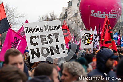 Sign saying in French 'No to the Macron pensions!' carried during a march against the French retirement reform Editorial Stock Photo