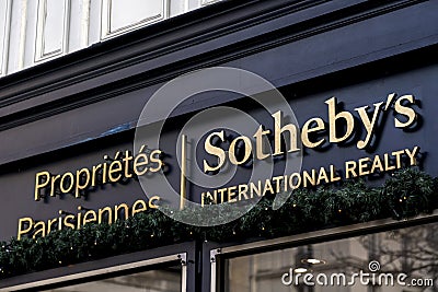 Sotheby`s International Realty`s Paris branch and logo signboard, Paris, France Editorial Stock Photo