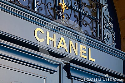 Chanel luxury store sign on blue door in place Vendome in Paris, France Editorial Stock Photo