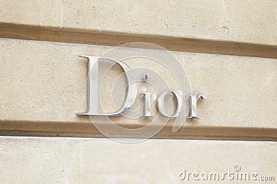 Dior, fashion luxury, silver sign in avenue Montaigne in Paris, France Editorial Stock Photo