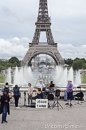 Paris, France - July 06, 2022: The sect of Jesus Christ gives a musical concert against the backdrop of the Eiffel Tower Editorial Stock Photo