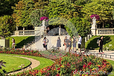 Tourists and Parisians relaxing in the Luxembourg Gardens. Paris Editorial Stock Photo