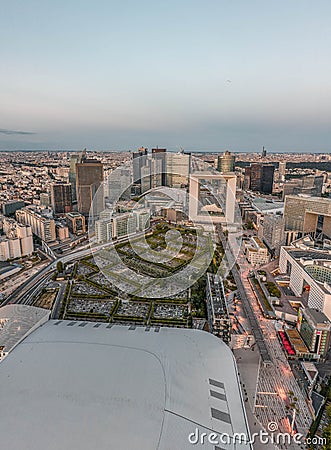 Paris, France - Jun 20, 2020: Aerial drone shot of La Defense skyscrapers post pandemic lockdown after sunset at dusk Editorial Stock Photo