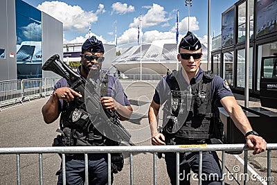PARIS, FRANCE - JUN 21, 2019: Armed French National Police on guard at the Paris Air Show Editorial Stock Photo