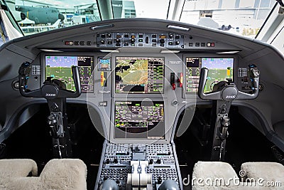 PARIS, FRANCE - JUN 21, 2019: Modern glass cockpit of the Dassault Falcon 2000S business jet at the Paris Air Show Editorial Stock Photo