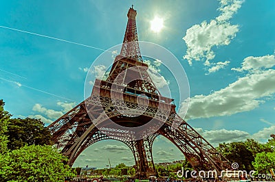 Paris, France June 1, 2015: Beautiful and world famous Eiffel Tower rises up from the city on a glorious sunny day Editorial Stock Photo