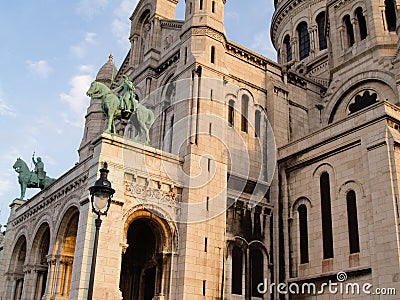 Bronze equestrian statues of King Louis 1V guarding entrance to Sacre Coeur Cathedral Stock Photo