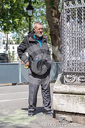 Dirty man in Paris Editorial Stock Photo