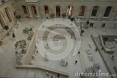 Paris, France - 02 23 2022: Louvre Museum. View of the Cour Marly and Central courtyard with statues and stairs stone Editorial Stock Photo