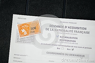 Overhead view of special document Application for acquisition of French Editorial Stock Photo