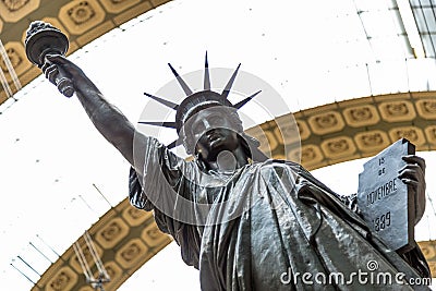 Paris, France, March 28 2017: A bronze replica of the Statue of Liberty by French sculptor Bartholdi stands in the Orsay Editorial Stock Photo
