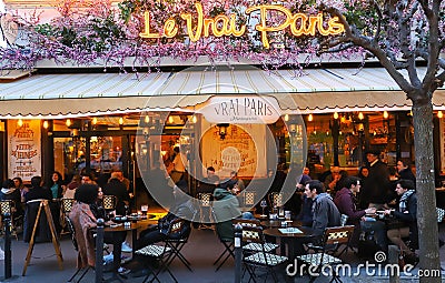 The famous Cafe Le Vrai Paris at night . It is located in the Montmartre, Paris, France. Editorial Stock Photo