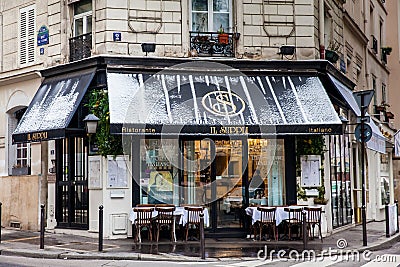 Italian restaurant at a beautiful corner of Paris in winter Editorial Stock Photo