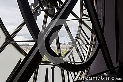 PARIS, FRANCE - MAY 9, 2019: Famous clock with roman numerals round window in Orsay Museum, Paris, France Editorial Stock Photo