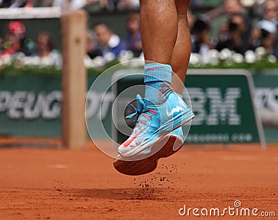 Fourteen times Grand Slam champion Rafael Nadal of Spain wears custom Nike tennis shoes during his second round match Editorial Stock Photo