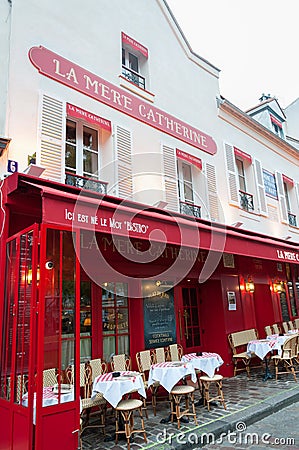 Paris, France, 11.22.2018 Montmartre, La Mere Catherine cafe bistro in red colors with tables for guests Editorial Stock Photo