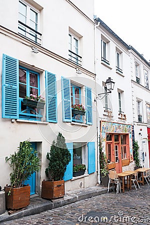 Paris, France, 11.22.2018 Montmartre, View of the traditional old French house facade in Paris with two windows. Stock Photo