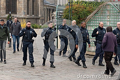 French riot policemen protecting Paris from violent attacks of yellow vests Gilets jaunes protesters Editorial Stock Photo