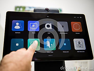 touching new Facebook Portal Plus with multiple icons on the dashboard display Editorial Stock Photo