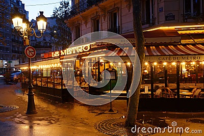 View of typical Parisian cafe Le Metro . It is located on famous Saint Germain boulevard in Paris, France. Editorial Stock Photo