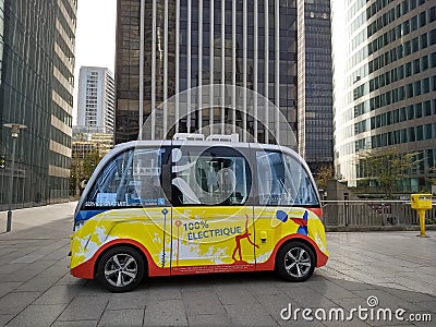 Paris / France - November 01 2017: Yellow unmanned electric bus in the modern district of La Defense in Paris. Editorial Stock Photo