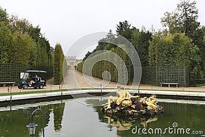 Scenic view of Flora Fountain in Gardens of Versailles at Paris, France under a cloudy sky Editorial Stock Photo