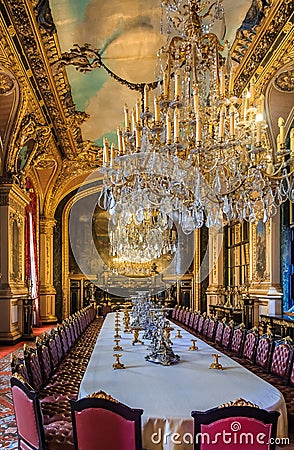 Banquet table in the apartments of Napoleon III in Louvre Museum in Paris, France with luxury baroque furnishings and stunning Editorial Stock Photo