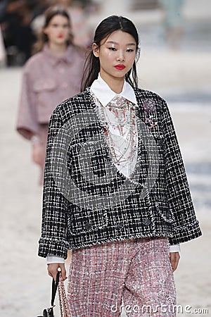 A model walks the runway during the Chanel show as part of the Paris Fashion Week Womenswear Spring/Summer 2019 Editorial Stock Photo