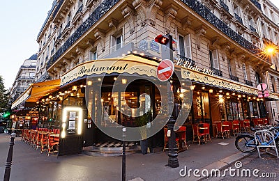 The traditional parisian restaurant Etoile 1903 at night . It located avenue Wagram in Paris, France. Editorial Stock Photo