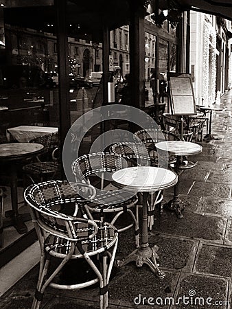 Paris, France, Parisian cafe, tables and chairs on paved sidewalk, black and white photo Stock Photo