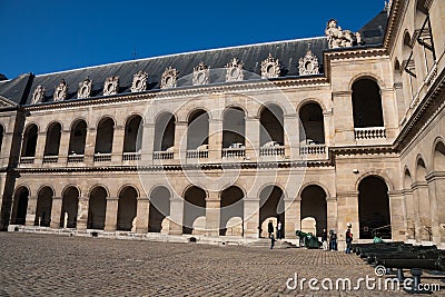 Courtyard at Hotel les Invalides Invalids Residence and the Army Museum with tourists and cannons Editorial Stock Photo