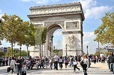 PARIS / FRANCE - September 23, 2011: Many people at the western end of the Avenue des Champs-Elysees with very famous monument &#x Editorial Stock Photo