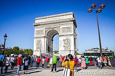 Paris - September 10, 2019 : Tourist taking pictures in front of Arc de Triomphe on place de lâ€™Etoile Editorial Stock Photo