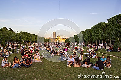 Paris, France - 1st June 2019: groups of people enjoying sunset on Parc de champs de mars Editorial Stock Photo