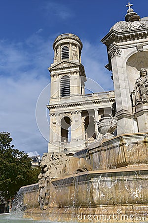 Eglise Saint Sulpice de Paris neoclassical facade and tower with Fountain. Paris, France. Stock Photo