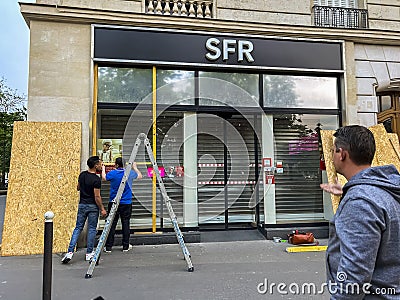 Paris, France, Anti-Government, Anti-Macron, Anti-Retirement Law Reform Demonstrations, Workers Install Protection Editorial Stock Photo