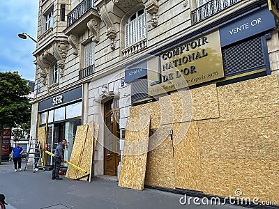 Paris, France, Workers Installing Protection on Shop WIndows, Place de la Nation, in Preparation of a large Anti-Government Editorial Stock Photo