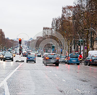 PARIS-JANUARY 10: Traffic on the Avenue des Champs-Ã‰lysÃ©es in a bad weather on January 10,2013 in Paris. Editorial Stock Photo