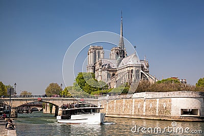 Paris, Notre Dame cathedral with boat on Seine, France Editorial Stock Photo