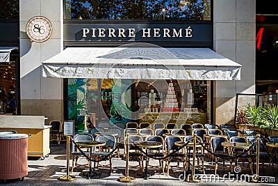 Paris - September 10, 2019 : The Pierre Herme pastry store on Champs-Elysees avenue Editorial Stock Photo