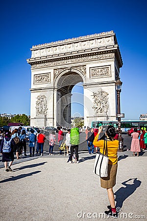 Paris - September 10, 2019 : Tourist taking pictures in front of Arc de Triomphe on place de lâ€™Etoile Editorial Stock Photo