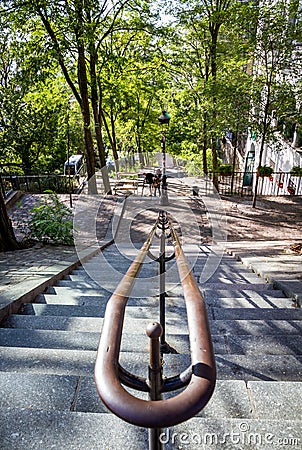 PARIS - September 6, 2019 : Typical Parisian stairway street on Butte Montmartre Editorial Stock Photo