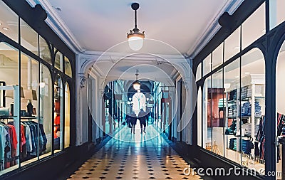 Parisian architecture and historical buildings, restaurants and boutique stores on streets of Paris, France Editorial Stock Photo