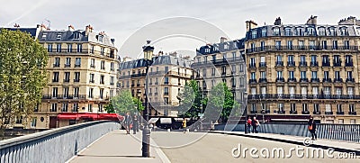 Parisian architecture and historical buildings, restaurants and boutique stores on streets of Paris, France Editorial Stock Photo