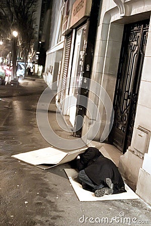 Parisian night, beggar Editorial Stock Photo