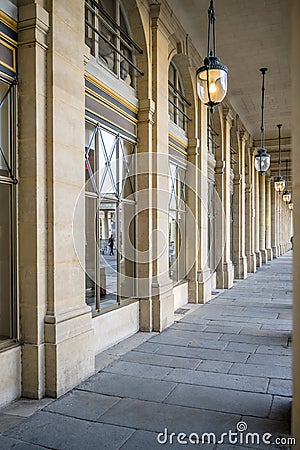 Arcade with reflection in the windows and pendant lights Stock Photo