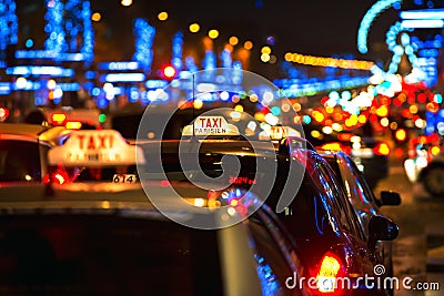 Parisian Taxi Cabs and Lights at the Champs Elysees in Paris, France Stock Photo