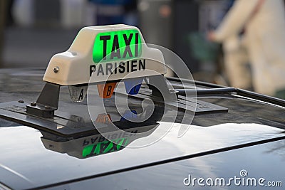 Parisian Taxi sign and car circulation in the Paris streets Stock Photo